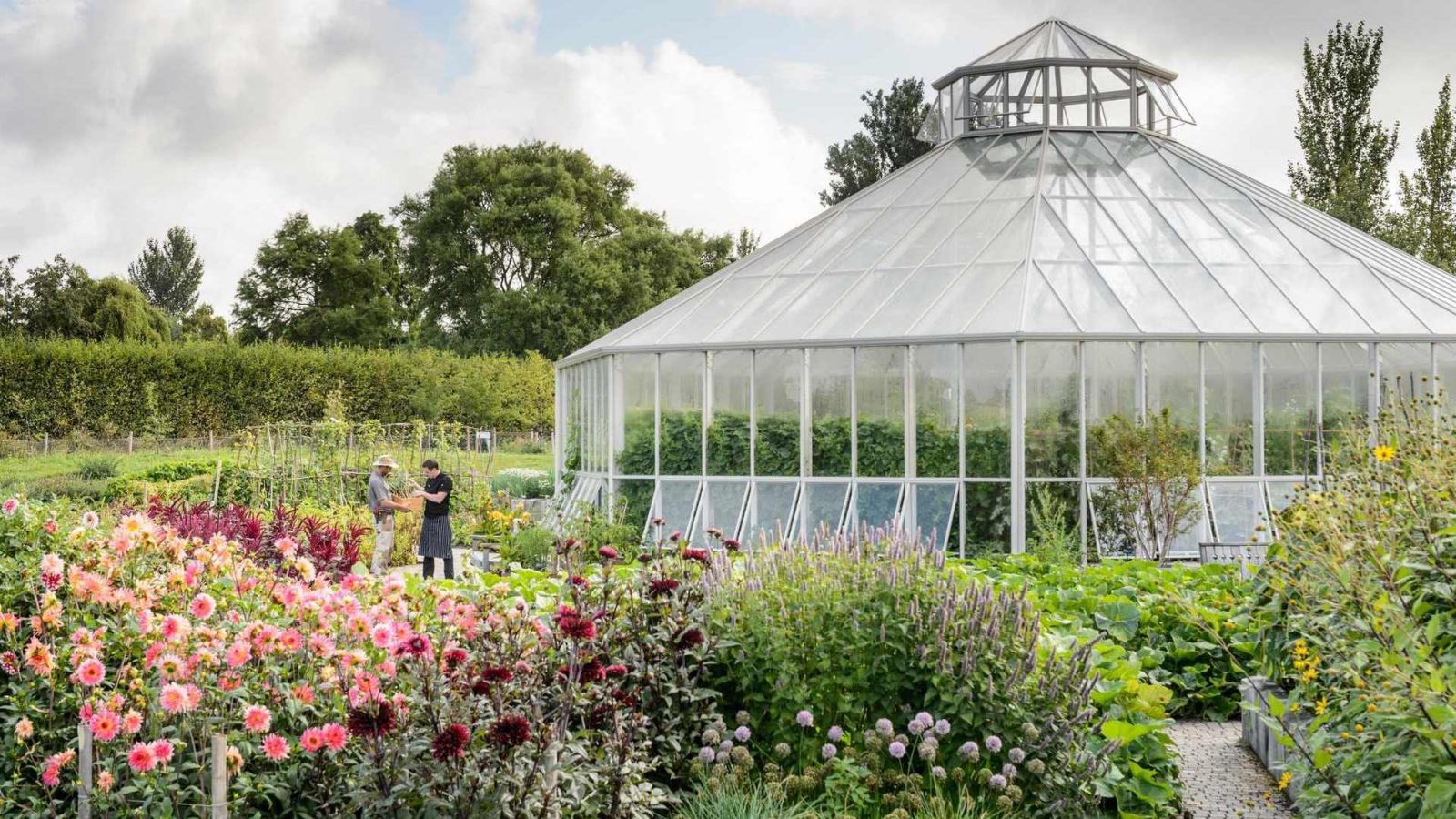 Gardens with large greenhouse